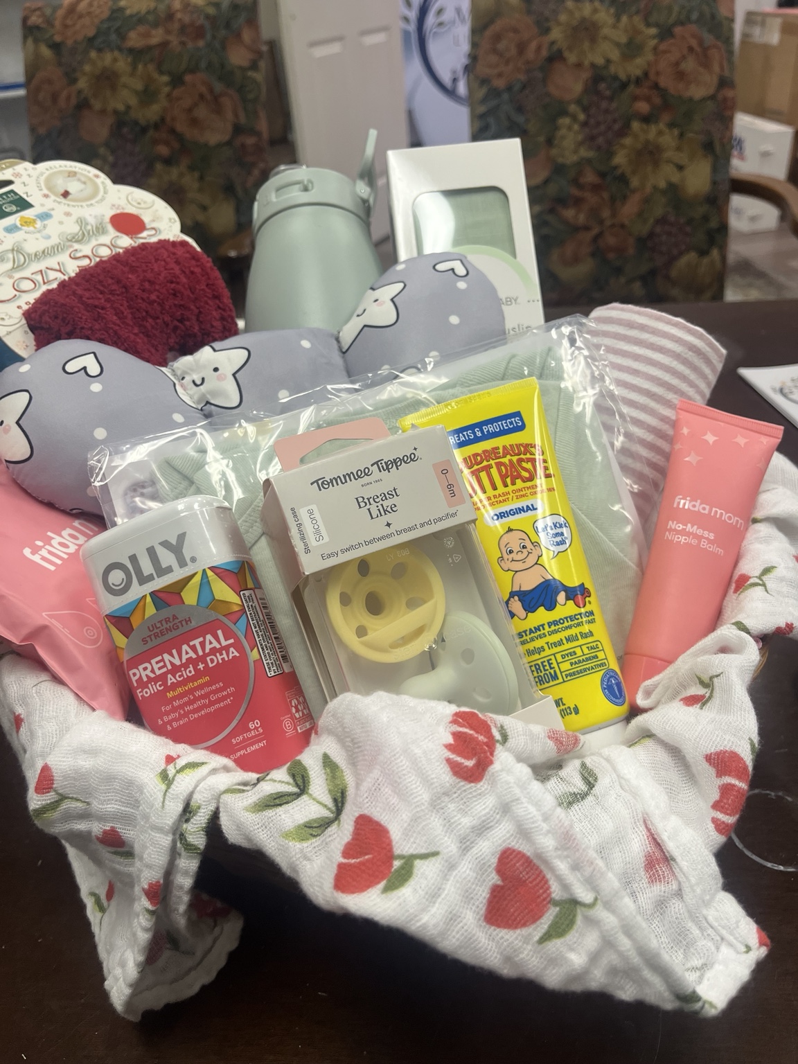 A NICU Mom and Baby basket filled with practical care items